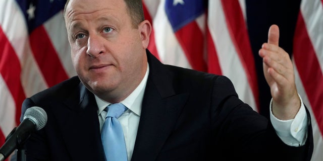 Colorado Governor Jared Polis points out at a press conference how the state will respond to the rapid rise in COVID-19 cases on Tuesday, November 24, 2020 in Denver. (AP photo / David Zalubowski)
