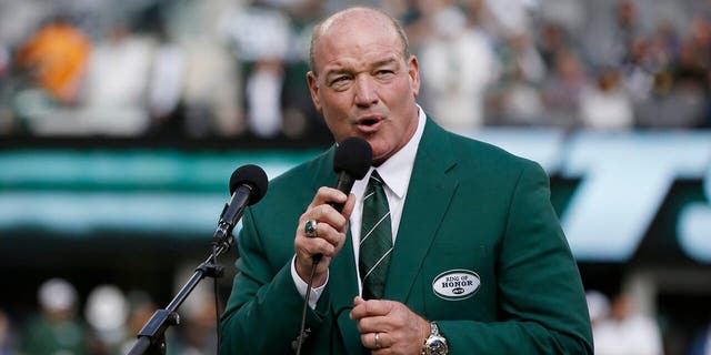 FILE - In this Oct. 13, 2013, file photo, Marty Lyons speaks as he is inducted into the New York Jets' Ring of Honor during a halftime ceremony of the team's NFL football game against the Pittsburgh Steelers in East Rutherford, N.J. (AP Photo/Kathy Willens, File)