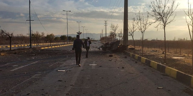 This photo released by the semi-official Fars News Agency shows the scene where Mohsen Fakhrizadeh was killed in Absard, a small city just east of the capital, Tehran, Iran, Friday, Nov. 27, 2020. Fakhrizadeh, an Iranian scientist that Israel alleged led the Islamic Republic's military nuclear program until its disbanding in the early 2000s was “assassinated” Friday, state television said. (Fars News Agency via AP)