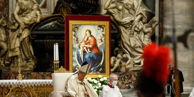 Pope Francis attends a consistory ceremony where 13 bishops were elevated to a cardinal's rank in St. Peter’s Basilica at the Vatican, Saturday, Nov. 28, 2020. (Fabio Frustaci/POOL via AP)