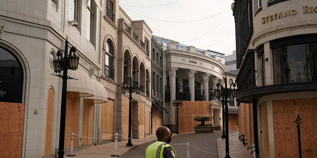 Luxury shops on Rodeo Drive are boarded up in anticipation of possible violent protests on Election Day Tuesday, Nov. 3, 2020, in Beverly Hills, Calif. (AP Photo/Jae C. Hong)