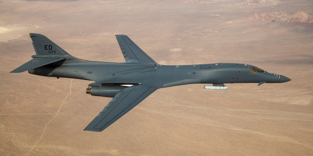 A B-1B Lancer with a Joint Air-to-Surface Standoff Missile (JASSM) flies in the skies above Edwards Air Force Base, California, Nov. 20, 2020.