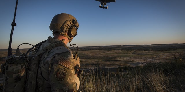 A Tactical Control Party Airmen and qualified Joint Terminal Aircraft Controller assigned to the 9th Air Support Operations Squadron at Fort Hood, Texas, directs an A-10 Thunderbolt II aircraft during a close-air-support exercise at Fort Hood, Texas Oct. 30, 2020.