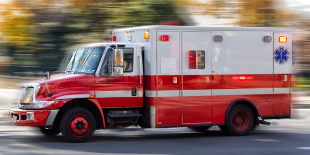 An ambulance on a city street. 