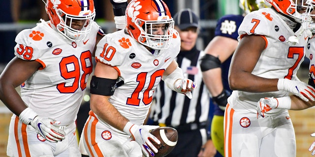 Clemson linebacker Baylon Spector (10) celebrates after recovering a Notre Dame fumble in the end zone during the third quarter of an NCAA college football game Saturday, Nov.. 7, 2020, in South Bend, Ind. (Matt Cashore/Pool Photo via AP)