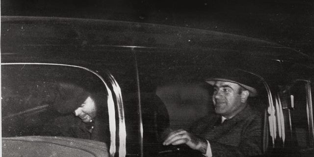 Al Capone, right, Chicago's infamous gang overlord during prohibition, leaves Harrisburg, Pa., on Nov. 16, 1939 with a federal officer for Lewisburg, Pa., where he was released after spending seven years in prison in Atlanta and San Francisco's Alcatraz. (AP Photo)