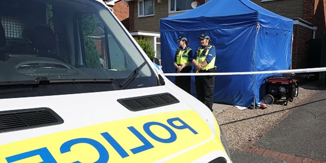 A police officer stands outside a house in Chester after healthcare professional, Lucy Letby, working at the Countess of Chester Hospital was arrested on suspicion of murdering eight babies and attempting to kill six others, on July 4, 2018 in Chester, United Kingdom. (Christopher Furlong/Getty Images)