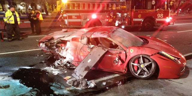 Chicago firefighters say a red Ferrari rented for the weekend crashed into Lake Shore Drive after getting wiped off the turn.