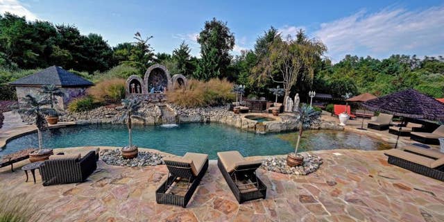 The mansion's Christmas decor goes as far as outside, with a nativity scene by the pool. (Courtesy of Robert DeFalco Realty/Guy Argenzio of Realty Photo Media)