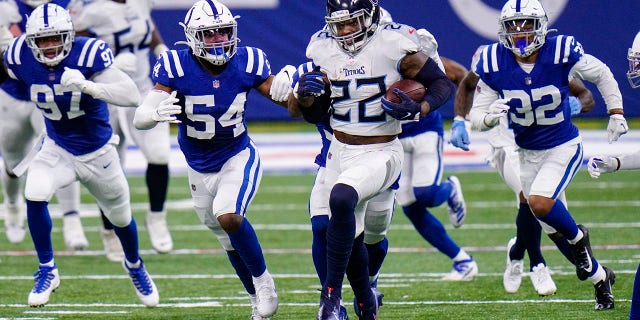 Tennessee Titans running back Derrick Henry (22) runs against the Tennessee Titans in the first half of an NFL football game in Indianapolis, Sunday, Nov. 29, 2020. (AP Photo/AJ Mast)
