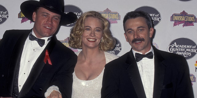 Doug Supernaw, best known for '90s hit 'Reno' died on Friday. He was 60. Photographed here from left to right is Supernaw, Cybill SHepherd and Aaron Tippin at the 30th annual Academy of Country Music Awards in Universal City, Calif.