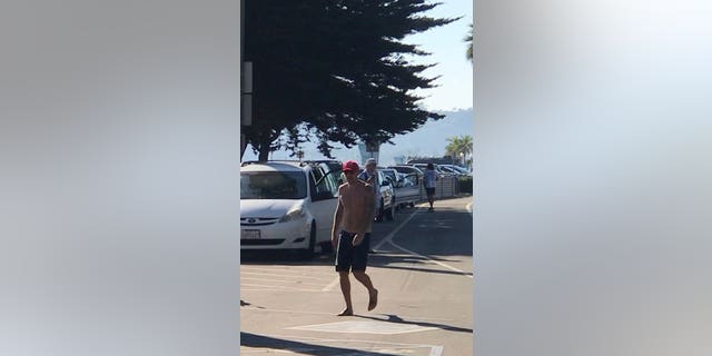 The shirtless man had allegedly harassed “numerous citizens on the beach and passing motorists” before attacking the victim and swiping his red hat and American flag, police said.