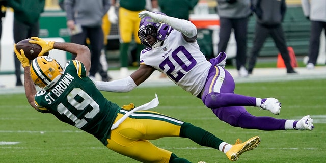 Green Bay Packers' Equanimeous St. Brown can't catch a pass with Minnesota Vikings' Jeff Gladney defending during the second half of an NFL football game Sunday, Nov. 1, 2020, in Green Bay, Wis. (AP Photo/Morry Gash)