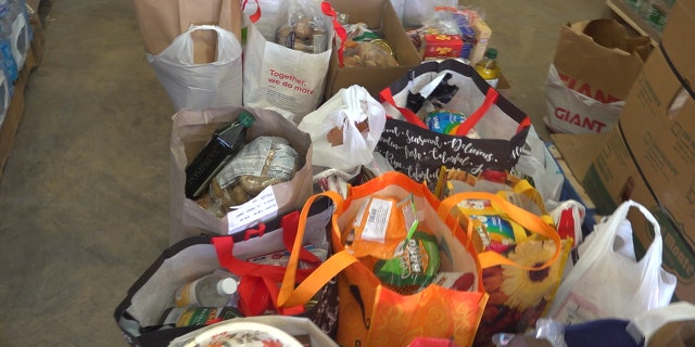 In the United States, thousands of people are lining up at food banks to help feed their families.