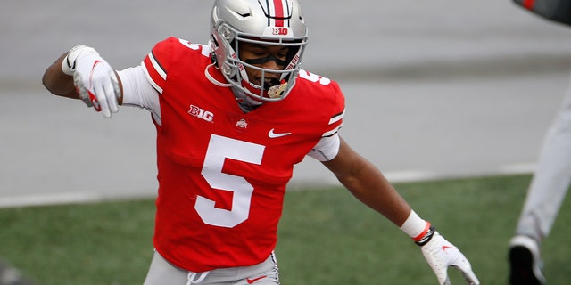 Ohio State receiver Garrett Wilson celebrates his touchdown against Indiana during the first half of an NCAA college football game Saturday, Nov. 21, 2020, in Columbus, Ohio. (AP Photo/Jay LaPrete)