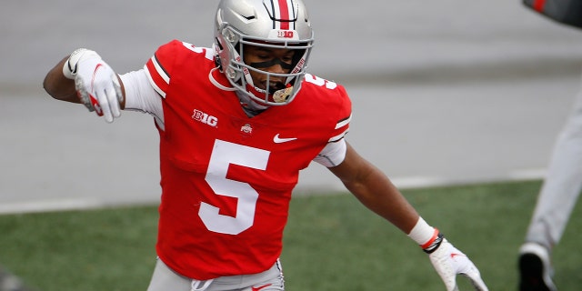 Ohio State receiver Garrett Wilson celebrates his touchdown against Indiana during the first half of an NCAA college football game Saturday, Nov. 21, 2020, in Columbus, Ohio. (AP Photo/Jay LaPrete)