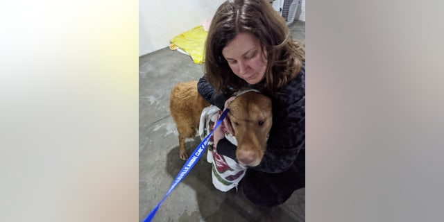 Olson and her pup, reunited after nearly a year apart.