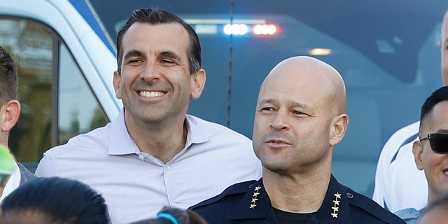 San Jose Police Department Police Chief Eddie Garcia, center right, and Mayor Sam Liccardo, center left, pose for picture. (Nhat V. Meyer/Digital First Media/The Mercury News via Getty Images)