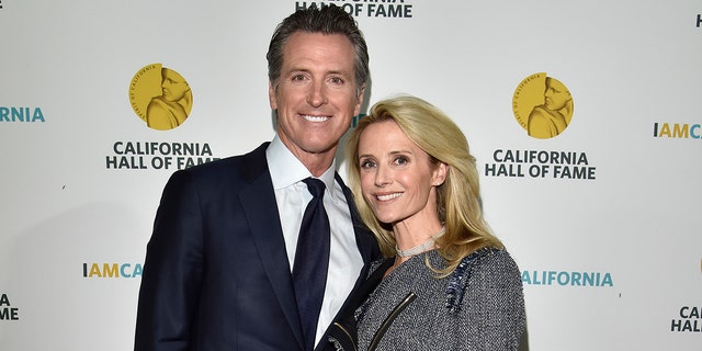 Then Governor elect Gavin Newsom (L) and wife Jennifer Siebel Newsom attend the 12th Annual California Hall of Fame Ceremony at The California Museum on Dec. 4, 2018 in Sacramento, California.