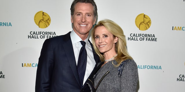 Then Governor elect Gavin Newsom (L) and wife Jennifer Siebel Newsom attend the 12th Annual California Hall of Fame Ceremony at The California Museum on Dec. 4, 2018 in Sacramento, California.