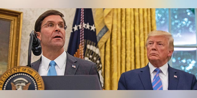 US Defense Secretary Mark Esper speaks after he was sworn in as President Donald Trump looks on in the Oval Office at the White House in Washington, DC, on July 23, 2019. - The Senate Tuesday voted overwhelmingly 90 to 8 to confirm President Donald Trump's pick for secretary of defense, Mark Esper, giving the Pentagon its first permanent chief since James Mattis stepped down in January. 