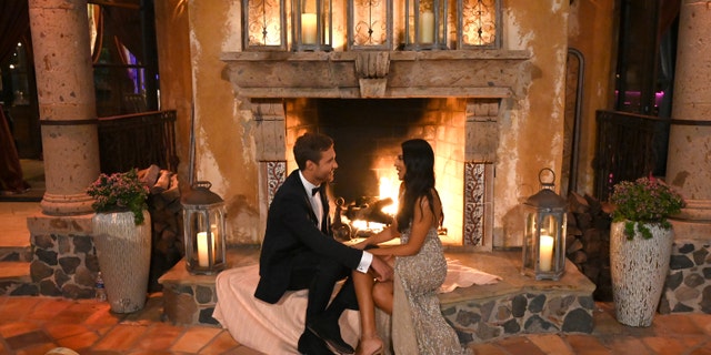Peter Weber chats with a date in the mansion during the premiere of Season 24 of "The Bachelor." (John Fleenor/ABC via Getty Images)