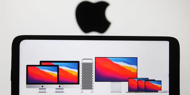 In this photo illustration Apple products seen on a mobile phone screen. Apple presented their new products of MacBook series computers during an Apple event. 