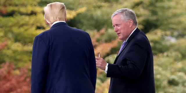 President Donald Trump confers with White House Chief of Staff Mark Meadows while departing the White House September 1, 2020 in Washington,  (Photo by Win McNamee/Getty Images)