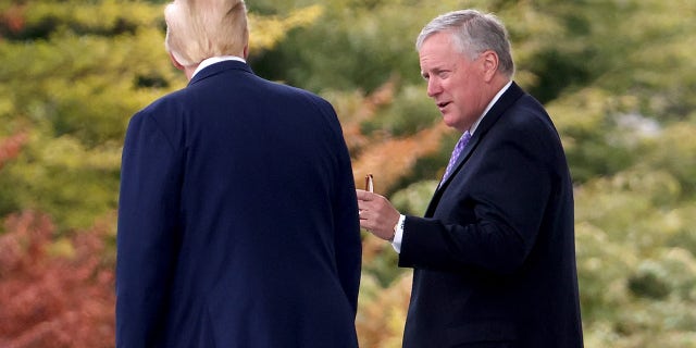 President Donald Trump confers with White House Chief of Staff Mark Meadows while departing the White House September 1, 2020 in Washington,  (Photo by Win McNamee/Getty Images)