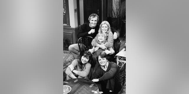 Pictured: (Front, l-r) Justine Bateman as Mallory Keaton, Michael J. Fox as Alex P. Keaton, (Back, l-r) Michael Gross as Steven Keaton, Meredith Baxter as Elyse Keaton, Tina Yothers as Jennifer Keaton in 'Family Ties.' (Photo by Paul Drinkwater/NBCU Photo Bank/NBCUniversal via Getty Images)