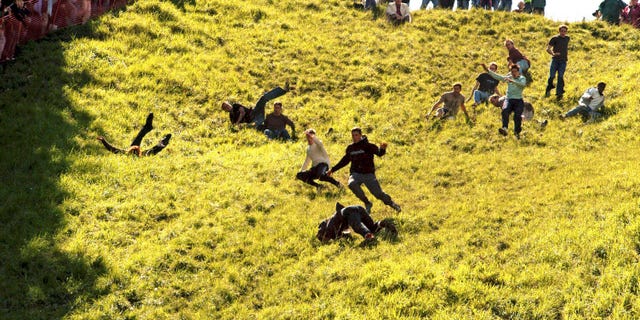 The Annual Cheese Roll held at Coopers Hill near Gloucester for at least 200 years the winner wins a double Gloucester cheese.; 12094; (Photo by Jules Annan/Photoshot/Getty Images)