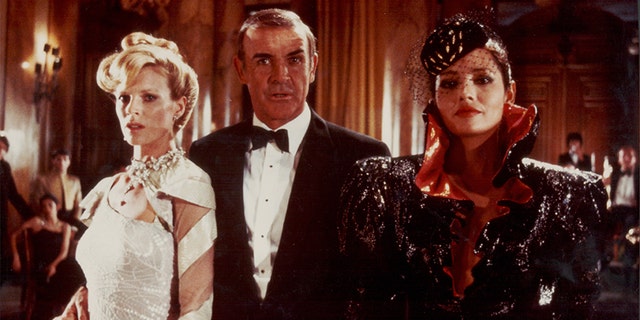 Actor Sean Connery as James Bond, with Bond girls Kim Basinger and Barbara Carrera, in a scene from the film 'Never Say Never Again,' 1983.