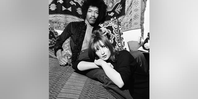 American singer and guitarist Jimi Hendrix with girlfriend Kathy Etchingham in his Mayfair flat, London, 7th January 1969.