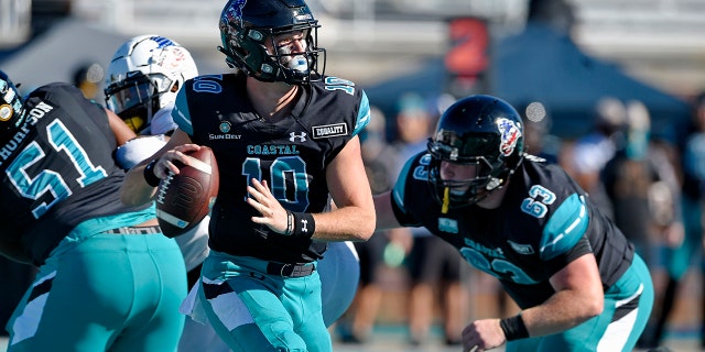 Coastal Carolina quarterback Grayson McCall (10) looks for a receiver during the first half of an NCAA college football game against Appalachian State, Nov. 21, in Conway, S.C. (AP Photo/Richard Shiro)