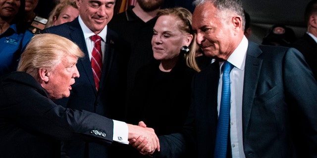 US President Donald Trump shakes Ike Perlmutter, CEO of Marvel Entertainment, hand before signing an executive order at the US Department of Veterans Affairs April 27, 2017 in Washington, DC. / AFP PHOTO / Brendan Smialowski (Photo credit should read BRENDAN SMIALOWSKI/AFP via Getty Images)