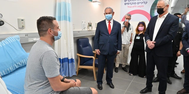 Segev Harel meets with Prime Minister Benjamin Netanyahu and Defense Minister Benny Gantz at Sheba Medical Center in Tel Aviv.