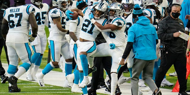 Carolina Panthers safety Jeremy Chinn (21) celebrates with teammates after returning a fumble 17-yards for a touchdown during the second half of an NFL football game against the Minnesota Vikings, Sunday, Nov. 29, 2020, in Minneapolis. (AP Photo/Jim Mone)