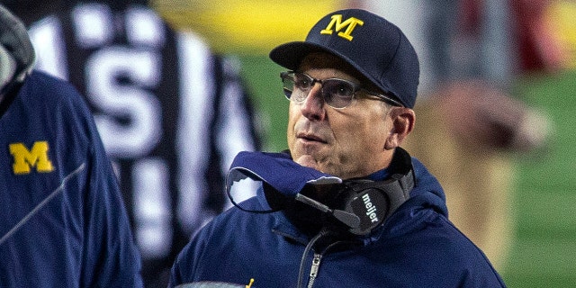 Michinga coach Jim Harbaugh on the sideline during the Wisconsin game in Ann Arbor, Michigan, Nov. 14, 2020. (AP Photo/Tony Ding)