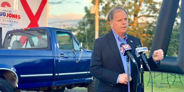 Democratic U.S. Sen. Doug Jones, of Alabama, speaks at a drive-in car rally in Troy, Ala., on Oct. 22, 2020. (Associated Press)