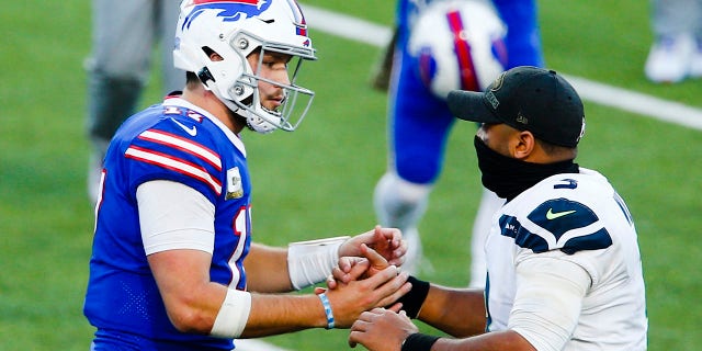 Buffalo Bills' Josh Allen, left, shakes hands with Seattle Seahawks' Russell Wilson after an NFL football game Sunday, Nov. 8, 2020, in Orchard Park, N.Y. (AP Photo/John Munson)