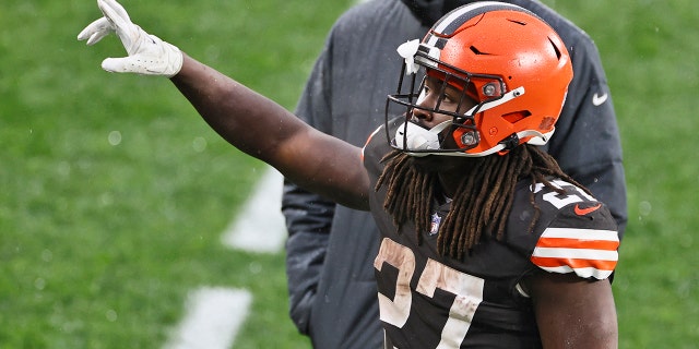 Cleveland Browns running back Kareem Hunt (27) celebrates after the Browns defeated the Philadelphia Eagles in an NFL football game, Sunday, Nov. 22, 2020, in Cleveland. (AP Photo/Ron Schwane)