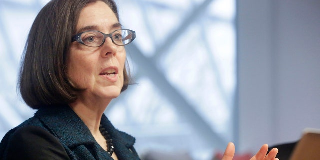 Kate Brown, governor of Oregon, speaks during an interview in Portland, Oregon, U.S. on Wednesday, Jan. 20, 2016. Brown, a Democrat, joined the state House of Representatives in 1991, was later elected to the Senate and served as secretary of state since 2009, before taking over as governor in February. Photographer: Meg Roussos/Bloomberg via Getty Images