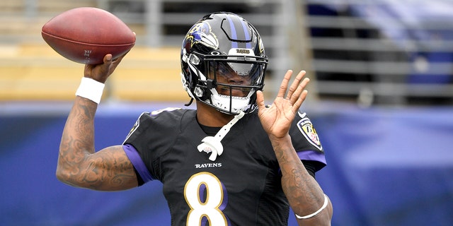 Baltimore Ravens quarterback Lamar Jackson works out prior to an NFL football game against the Tennessee Titans, Sunday, Nov. 22, 2020, in Baltimore. (AP Photo/Nick Wass)