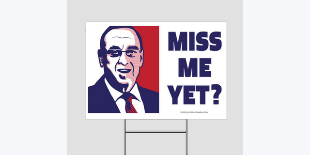 Yard signs with a photo of former Gov. Paul LePage and the caption