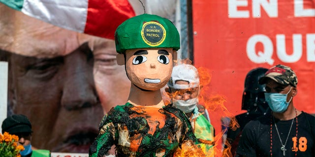 Protesters also burned a piñata depicting a U.S. border patrol agent.