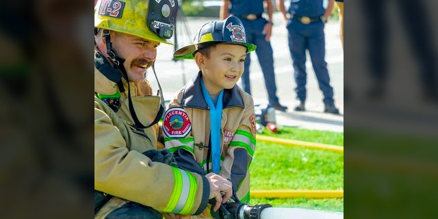 Mason Ochoa, 4, was made honorary firefighter/paramedic for saving his 2-year-old brother from drowning.  