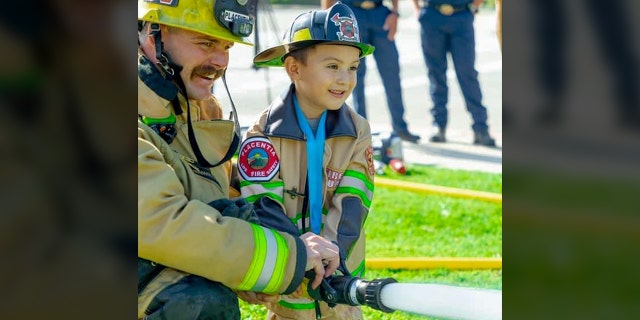 Mason Ochoa, 4, was made honorary firefighter/paramedic for saving his 2-year-old brother from drowning.