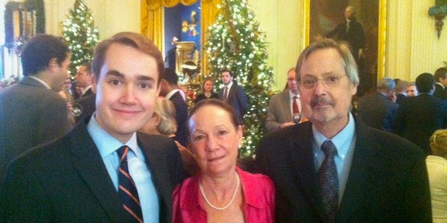 Bates, left, with his mother and his late father at the White House.