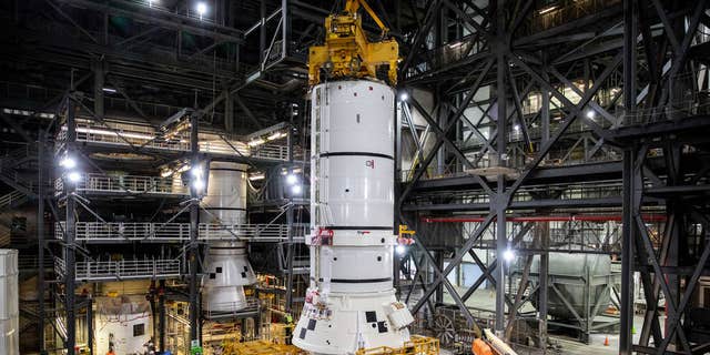 The rear parts of the Space Launch System solid rocket launchers for the Artemis I mission are preparing to move from High Bay 4 inside NASA's Vehicle Assembly Building (VAB) at Kennedy Space Center in Florida to the mobile launcher inside the high bay 3 to stack.