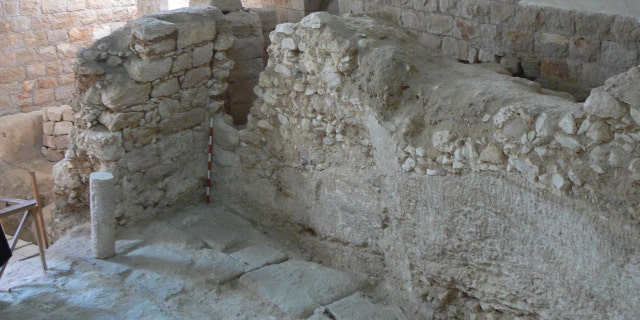 The first-century A.D. house showing one of its rock-cut walls.